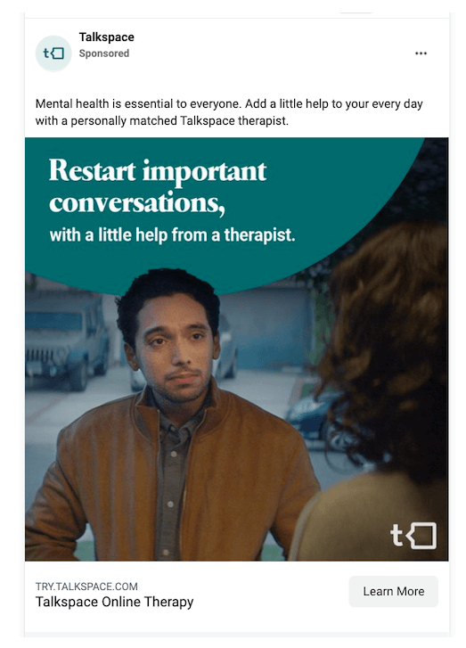 A man and a woman sit facing each other, engaging in a serious conversation. The text reads: ‘Restart important conversations, with a little help from a therapist.’ Branding and call-to-action for Talkspace.